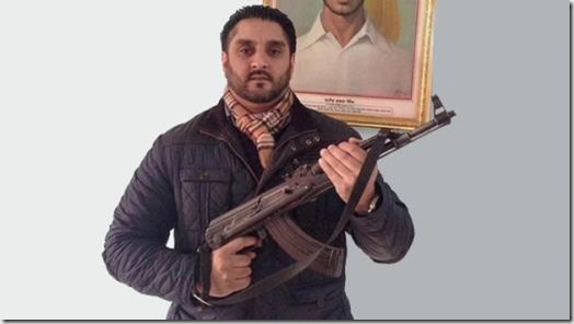 Ajit Atwal and AK-47 pose
